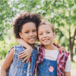 Two young girls hugging