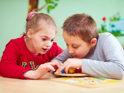 Two primary aged children at school