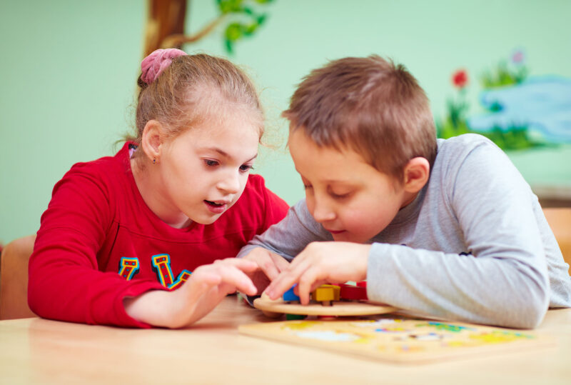 Two primary aged children at school