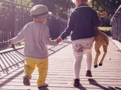 children running holding hands (Devon's SEND Local Offer)