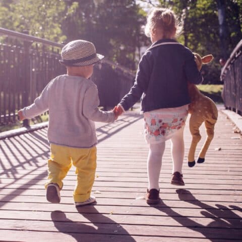 children running holding hands (Devon's SEND Local Offer)
