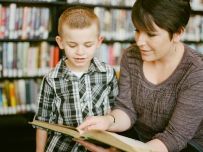 a adult reading a book with a child