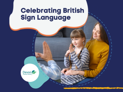 Photo of a young girl using British Sign Language with her parents. Text reads 'Celebrating British Sign Language'