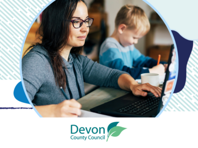A woman at home on a laptop with a young boy next to her. There's a Devon County Council logo at the bottom