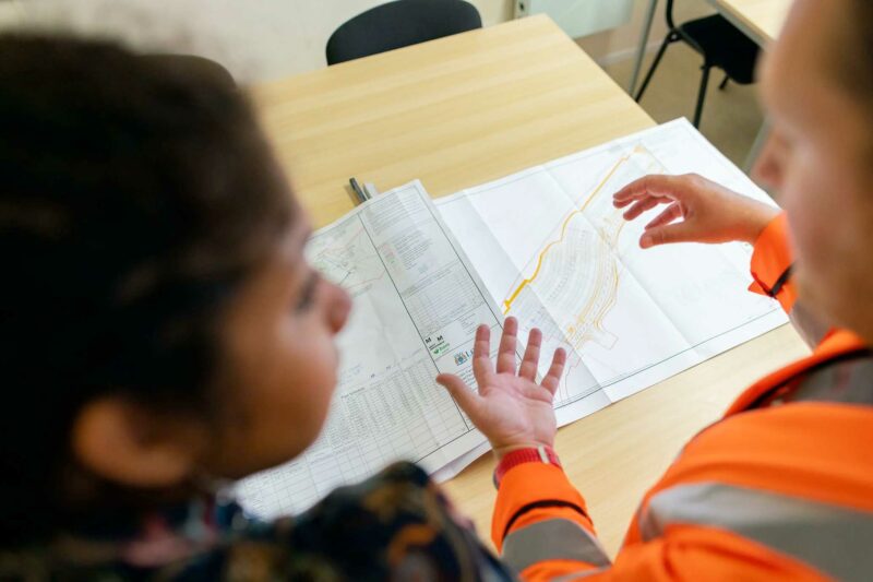 Trader and homeowner reviewing plans