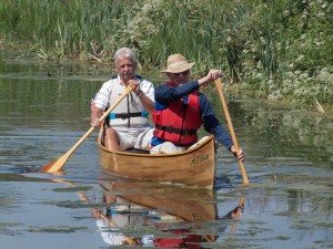 2 men boating on the Canal. 