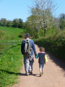 Father and son walking beside the Canal. 