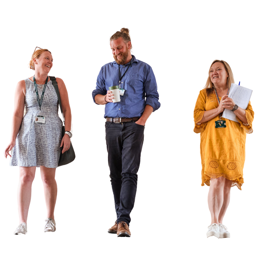 Three people walking towards camera.