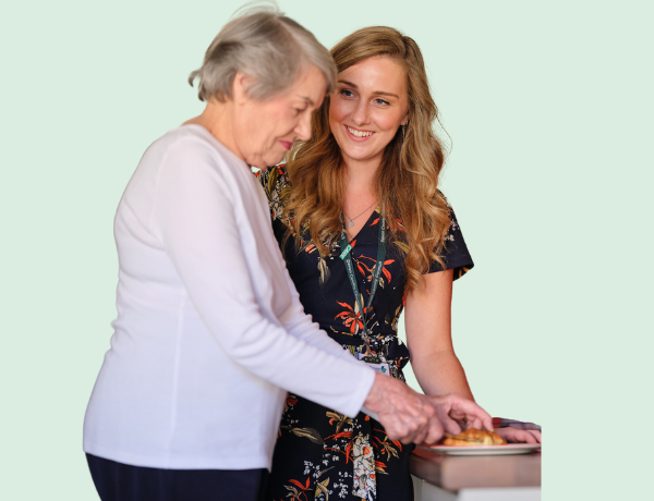 Occupational Therapist talks to patient.